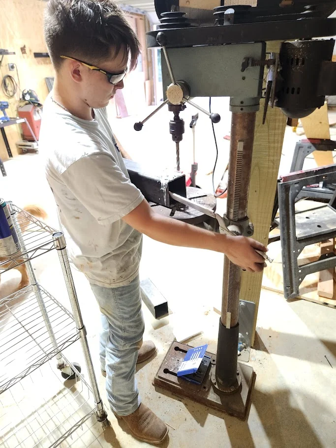 Working with a drill press in the family workshop